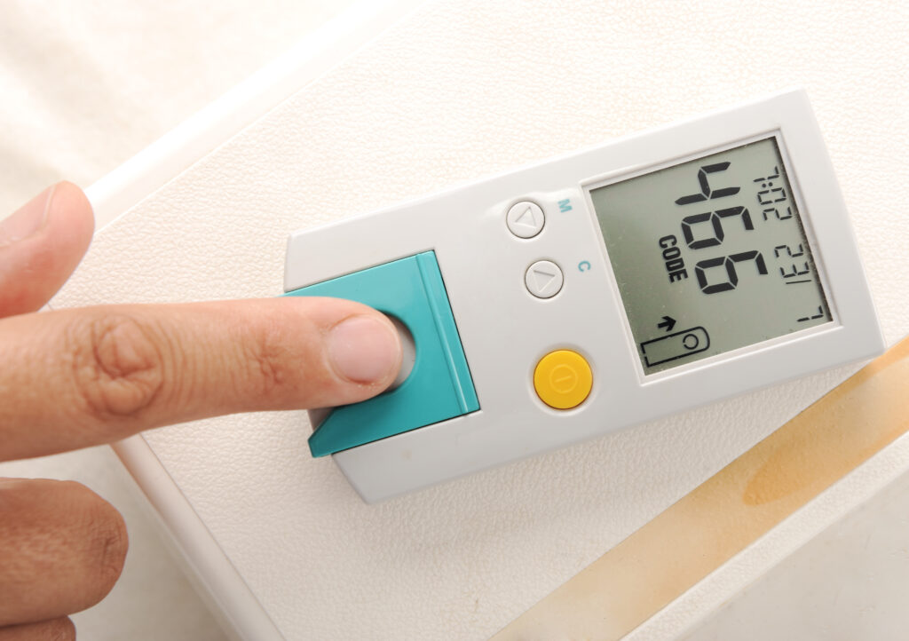 Diabetes patient measuring glucose level blood test